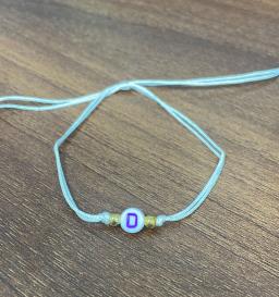 PULSERA DE LETRAS CD